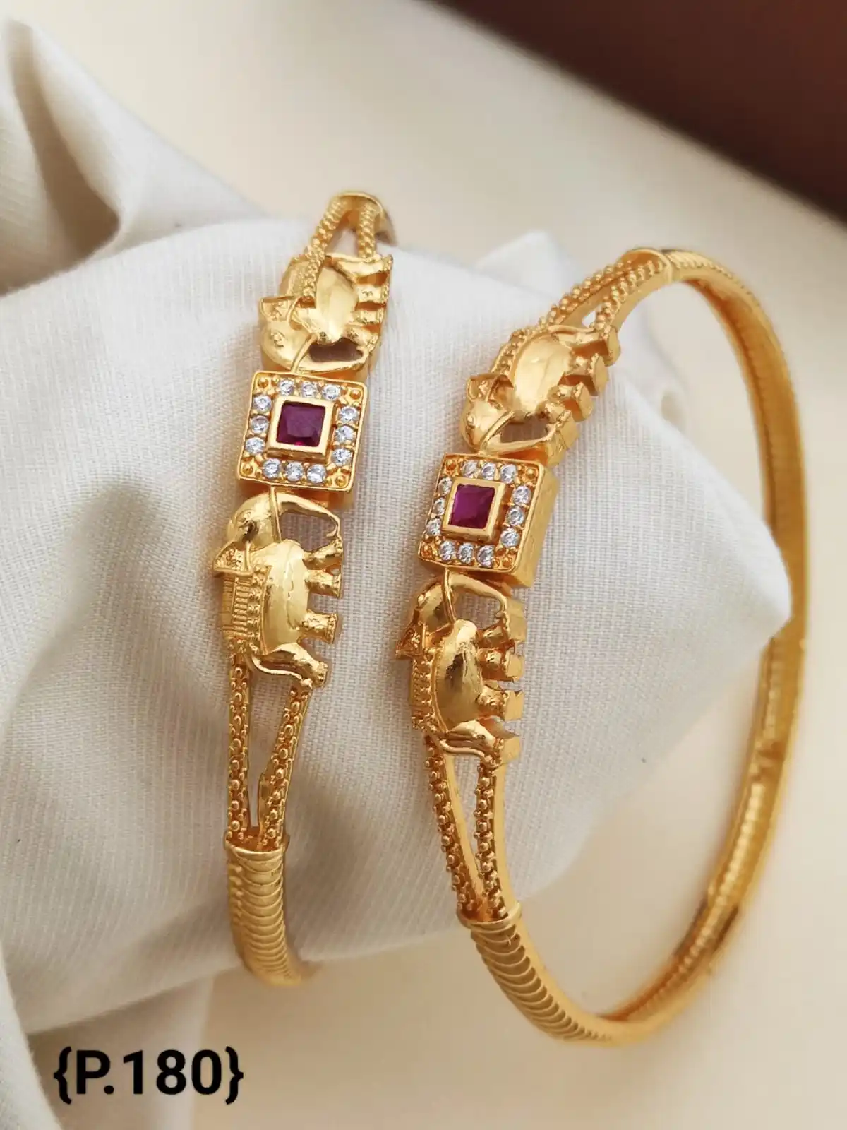 Stylish Daily Wear Golden Bangles With American Diamond.png